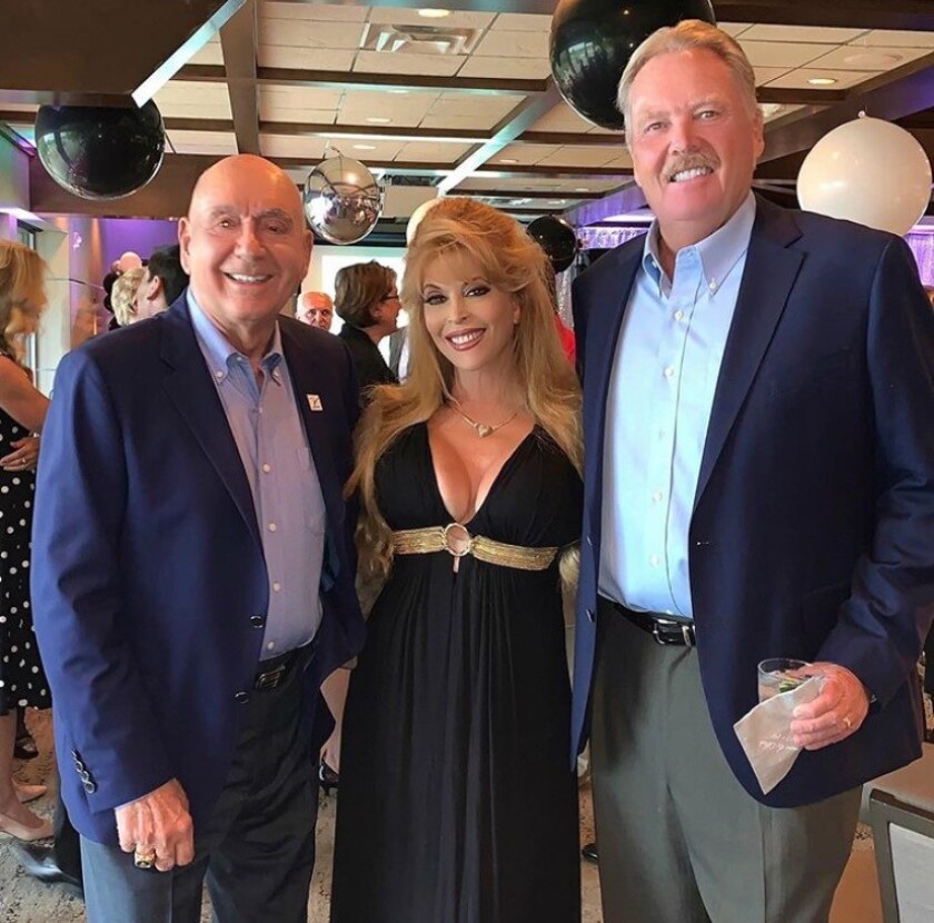 Tom Niedenfuer, right, with his wife, Judy Landers and basketball commentator Dick Vitale in 2019.