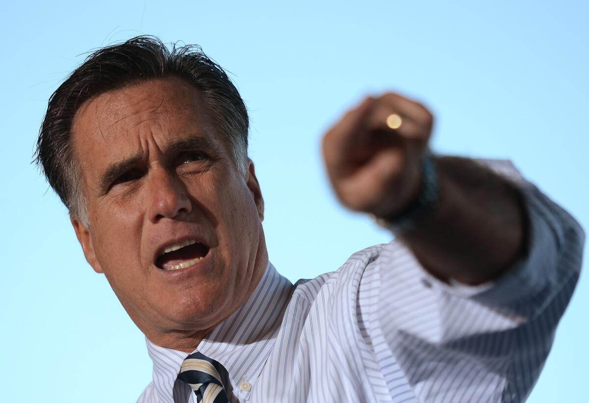 Mitt Romney speaks at a rally in Tampa, Fla.
