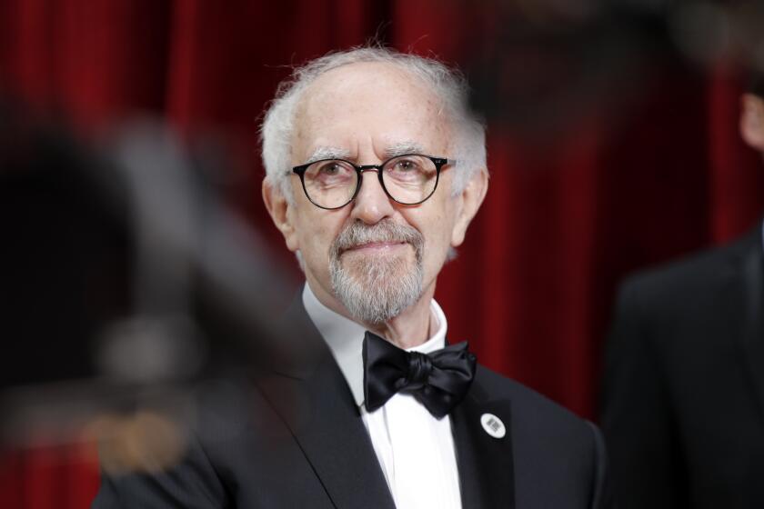 FILE - In this Sunday, Feb. 9, 2020 file photo, Jonathan Pryce arrives at the Oscars, at the Dolby Theatre in Los Angeles.