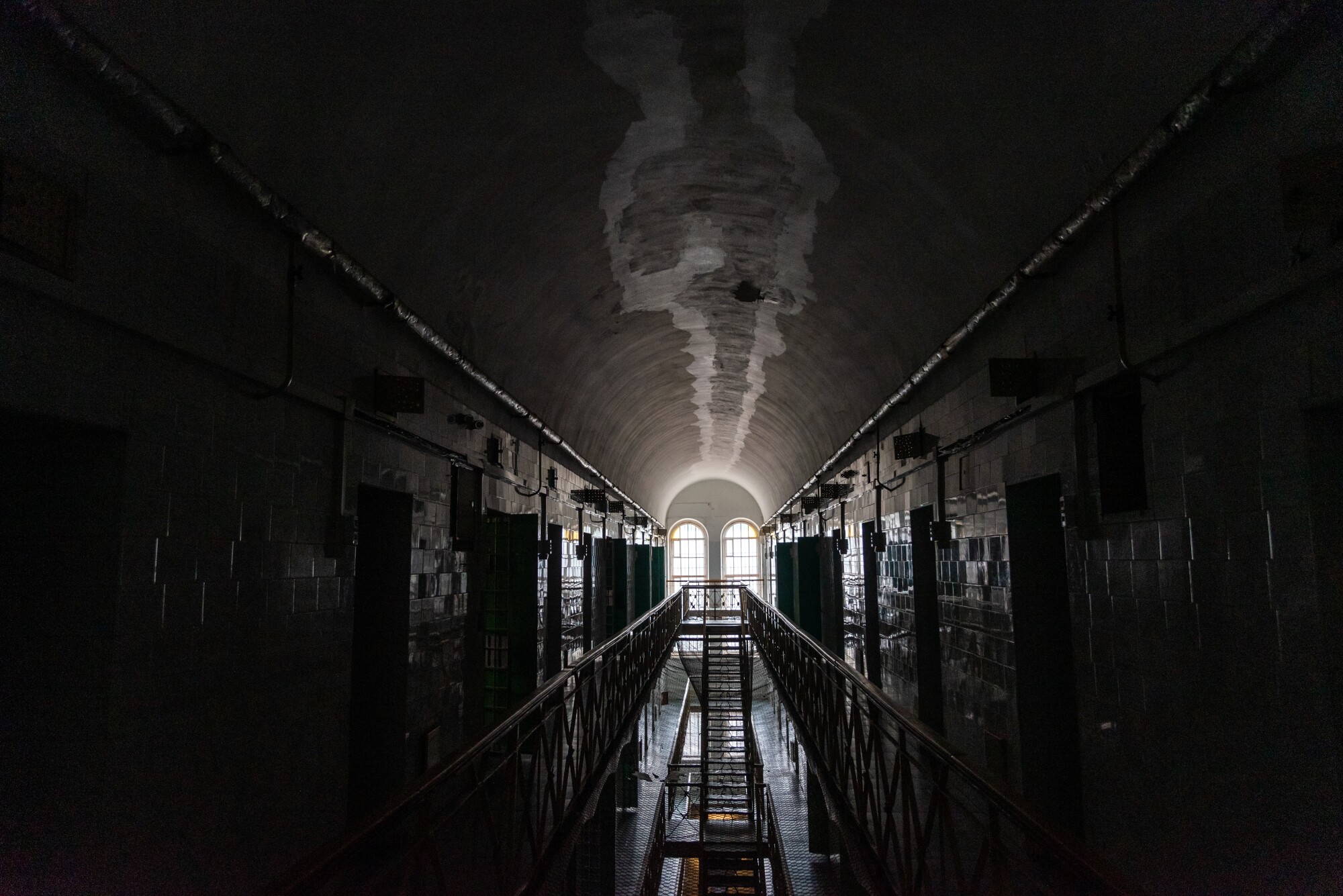A long, dark corridor of the former Lukiskes Prison