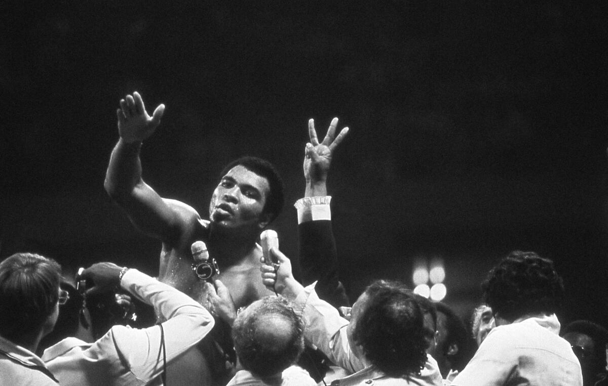 Muhammad Ali speaks to the press after a fight in New Orleans in 1978.