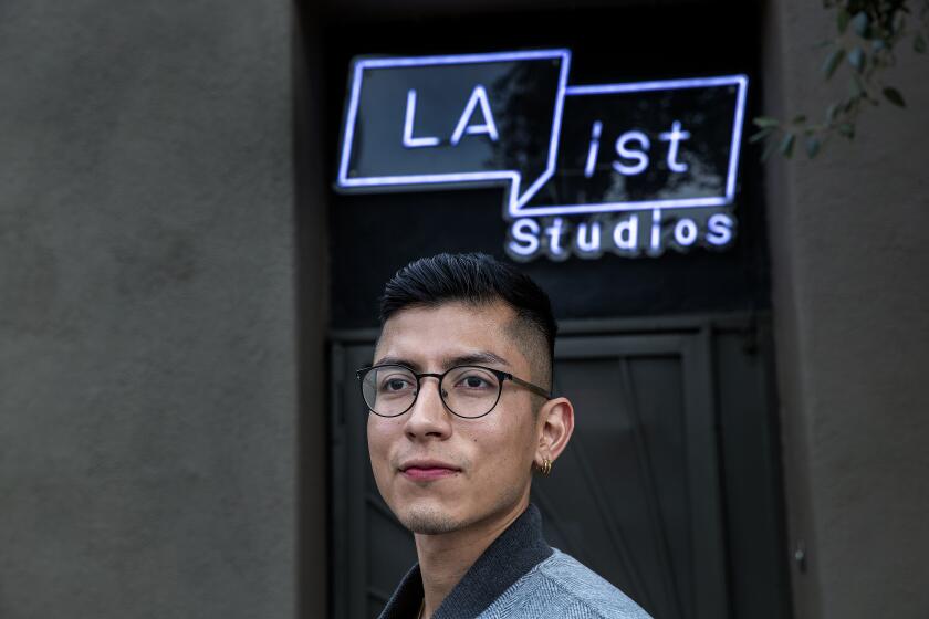 PASADENA, CA-JANUARY 13, 2023:Brian De Los Santos, host of the LAist Studios podcast, How to L.A., is photographed at Southern California Public Radio's offices and studios in Pasadena. De Los Santos' show is also broadcast on KPCC, which is changing its name to LAist 89.3. (Mel Melcon / Los Angeles Times). Photos are embargoed until 6am, January 31, 2023