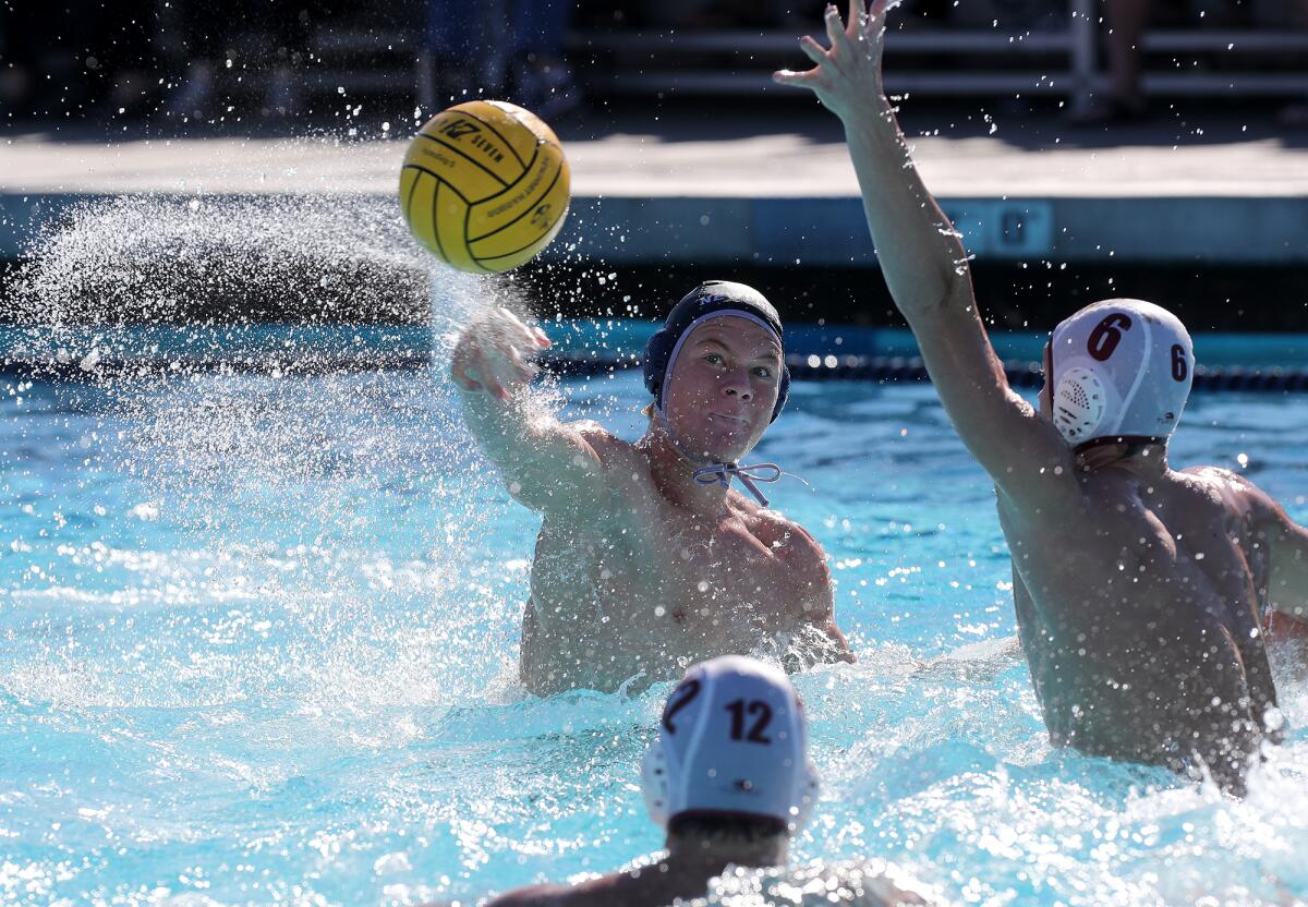 Newport Harbor's Finn LeSieur, left, scores against JSerra during the first half of Saturday's match.