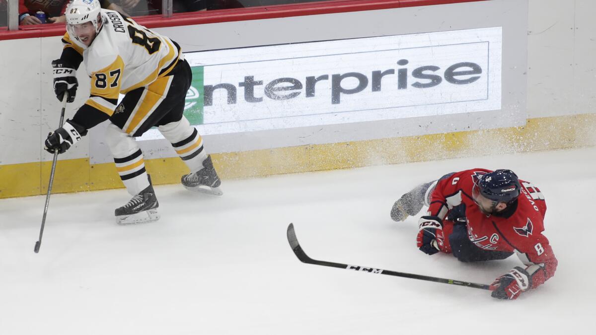 Pittsburgh Penguins' Sidney Crosby gets tangled up by Toronto