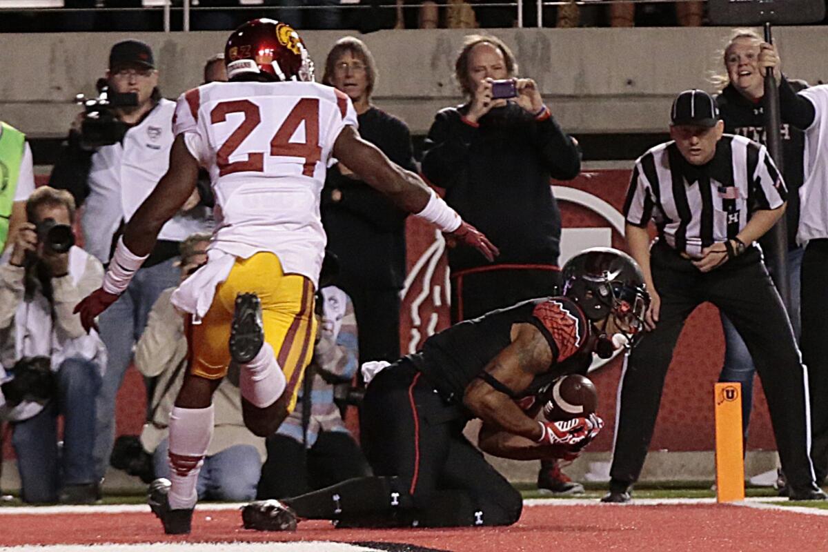 Utah receiver Kaelin Clay hauls in the game-winning, one-yard touchdown catch against cornerback John Plattenburg and USC with eight seconds left.