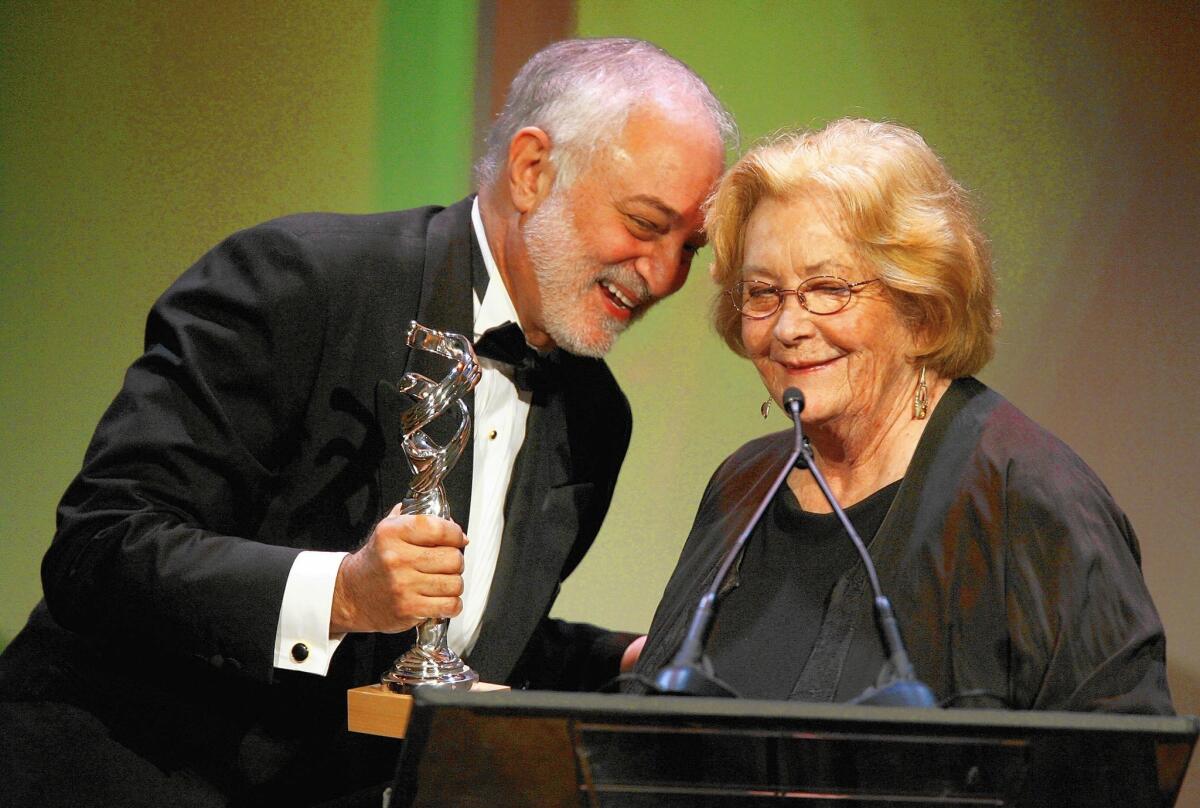 Producer Jonathan Sanger presents costume designer Patricia Norris the Lacoste Career Achievement in Film award onstage during the Costume Designers Guild Awards in Beverly Hills in 2007.