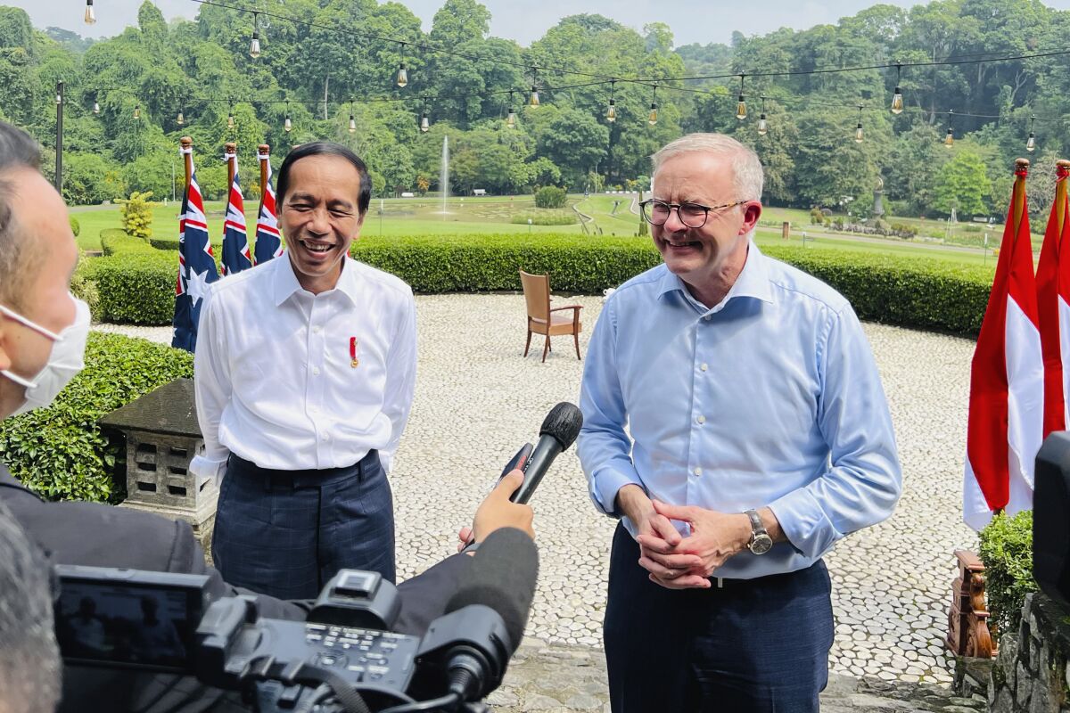 In this photo released by the Indonesian Presidential Palace, Indonesian President Joko Widodo, left, shares a light moment with Australian Prime Minister Anthony Albanese during a news conference following their meeting at Bogor Palace in Bogor, Indonesia, Monday, June 6, 2022. Albanese on Monday looked to move beyond regional issues that have been a key part of his trips abroad by promoting the importance of building stronger economic ties with neighboring Indonesia. (Laily Rachev, Indonesian Presidential Palace via AP)