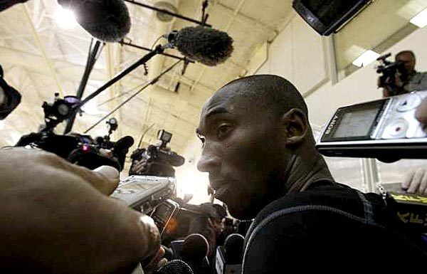 Lakers guard Kobe Bryant answers questions from the media after the team's first practice on Friday.