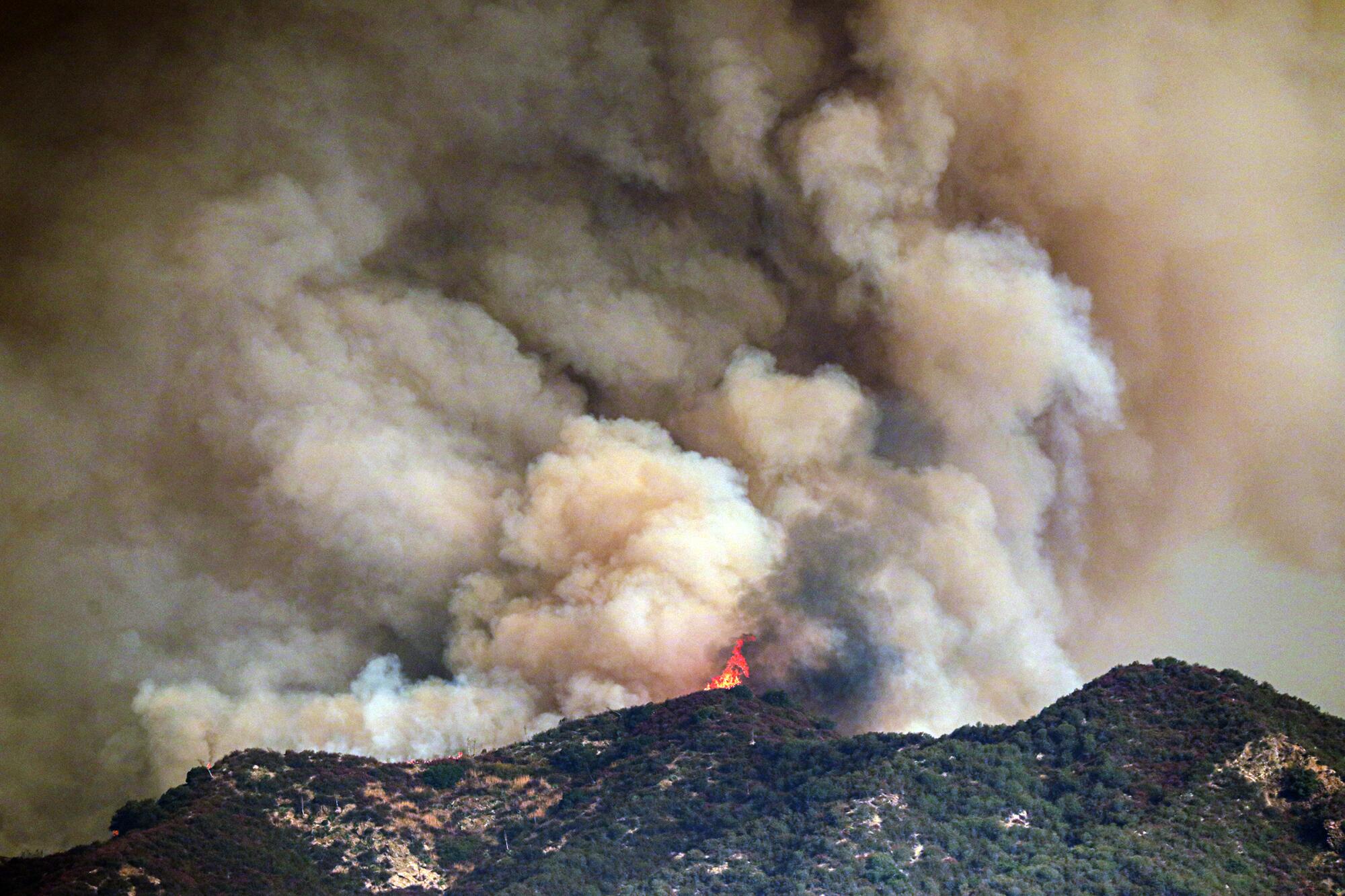 The Bobcat fire rages above Rincon Fire Station on Highway 39 in the San Gabriel Mountains.