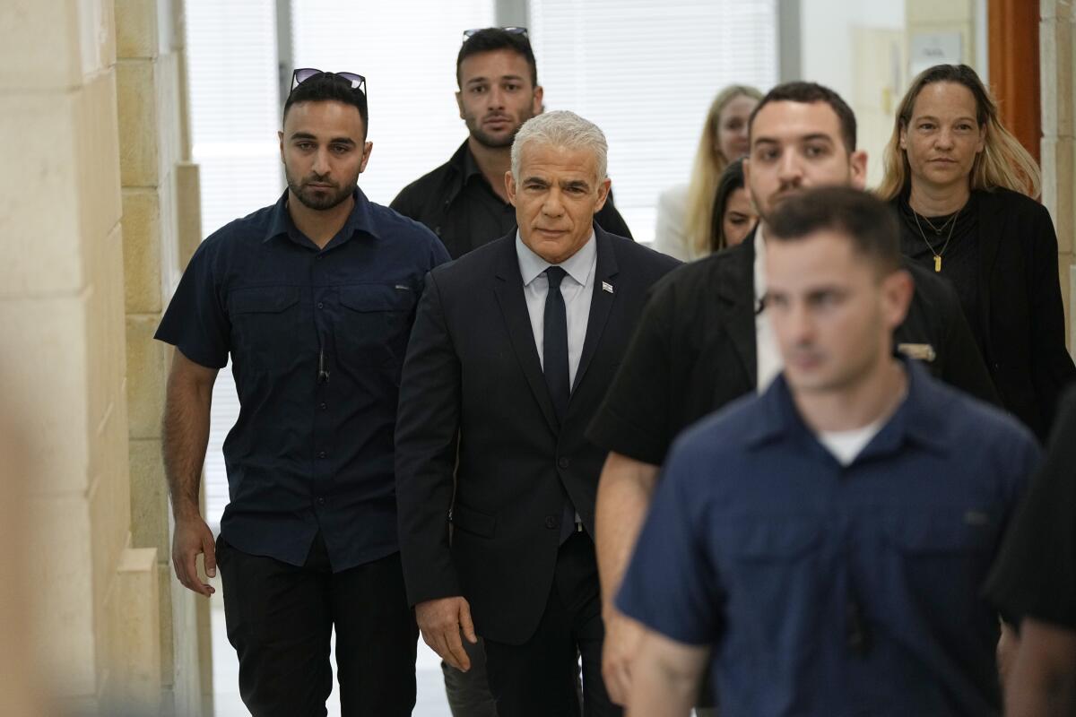 Israeli opposition leader Yair Lapid arriving at courthouse