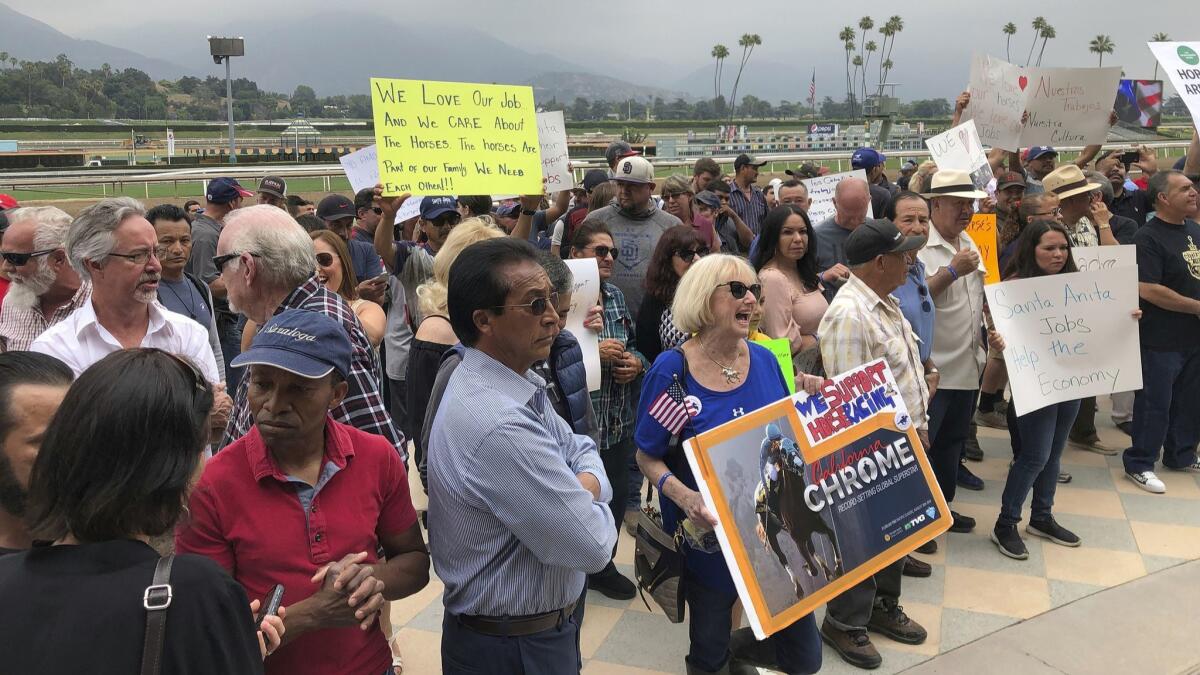 Santa Anita Park workers hold a rally at the track earlier this week.