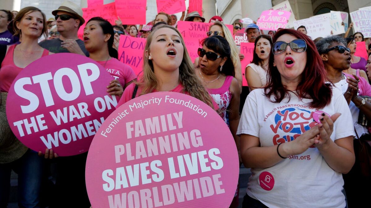 Planned Parenthood supporters rally for women's access to reproductive health care on "National Pink Out Day" at Los Angeles City Hall on Sept. 9, 2015.