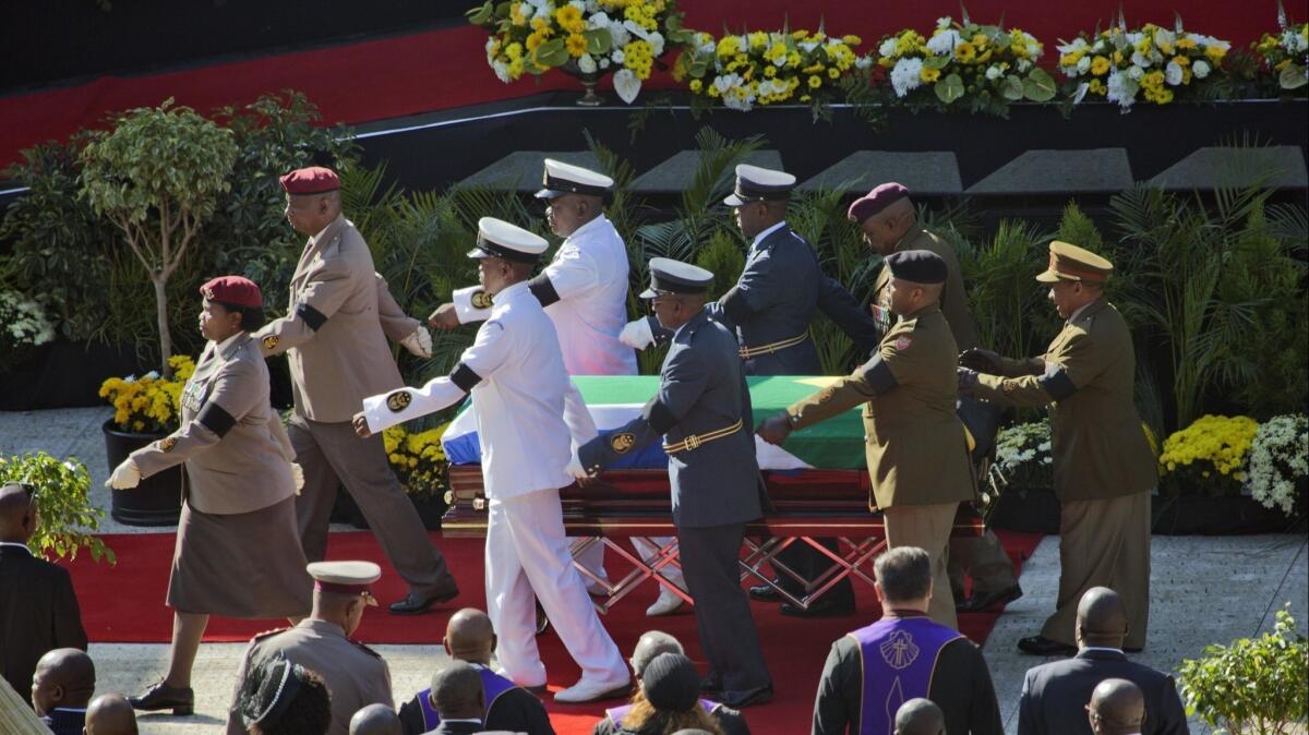 The coffin of Winnie Madikizela-Mandela arrives at Orlando Stadium in Soweto for her funeral Saturday.