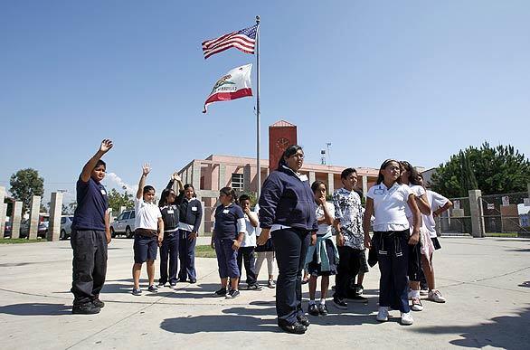 Garfield Elementary fifth-graders gather in front of the school to conduct a study for International Walk to School Week in Santa Ana. The group reenacted their walk to and from school, listing the obstacles they encountered.