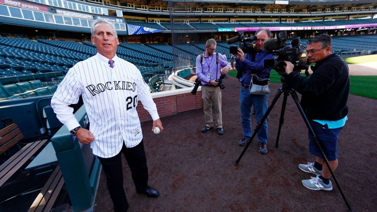 Bud Black poses for photographers at Coors Field following a news conference to introduce him as the new Colorado Rockies manager on Monday, Nov. 7, 2016, in Denver.