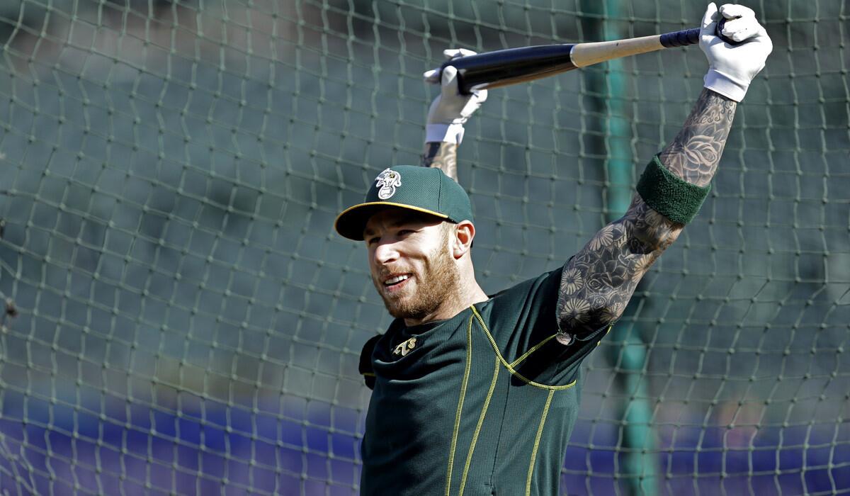 Oakland Athletics' Brett Lawrie stretches during batting practice before a game against the Houston Astros on Friday.
