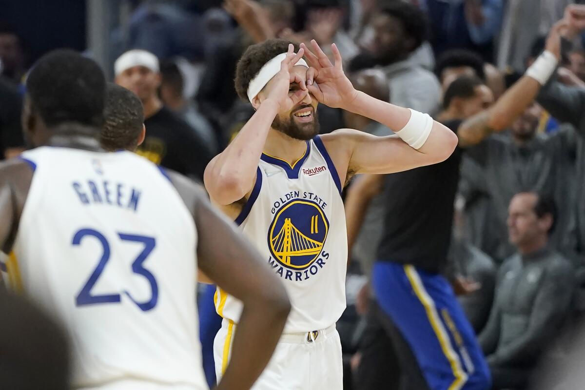 Golden State Warriors guard Stephen Curry gestures after shooting