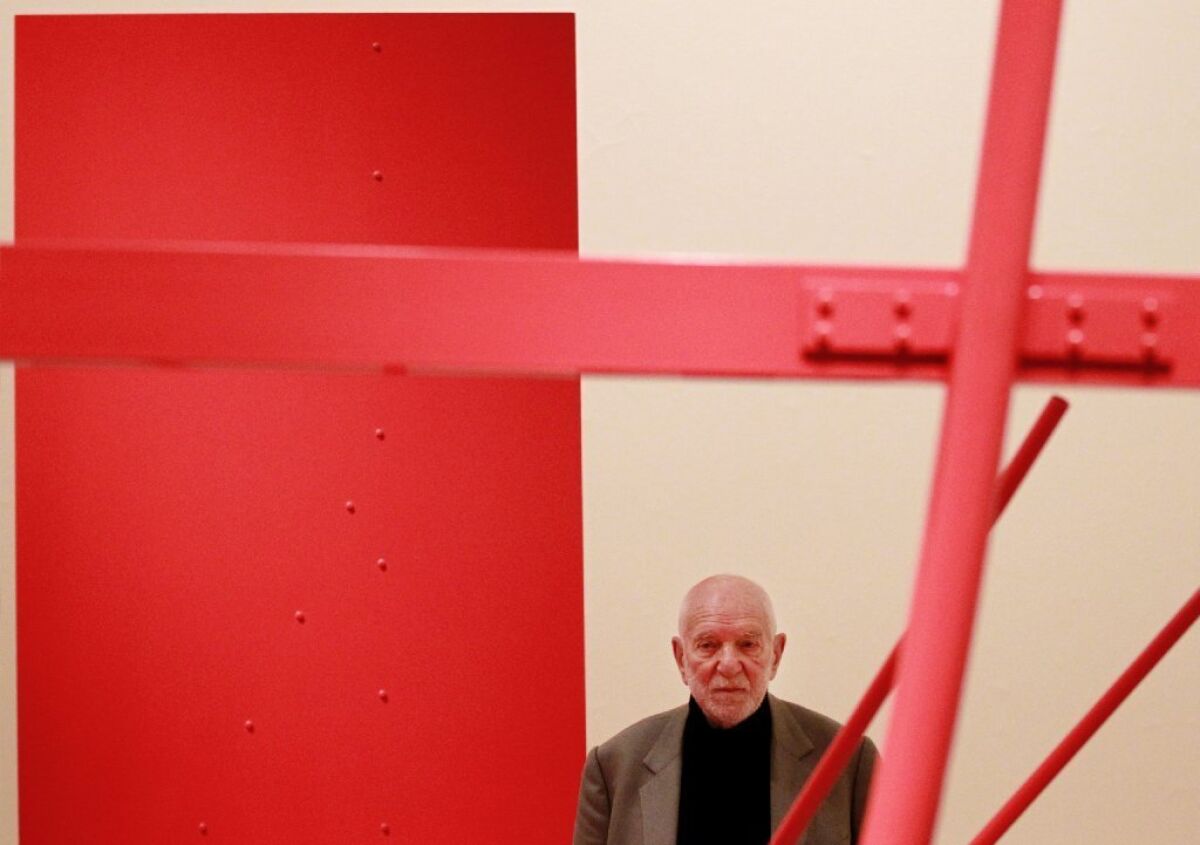 Sculptor Anthony Caro poses with one of his creations at the Royal Academy of Arts in London in 2011.