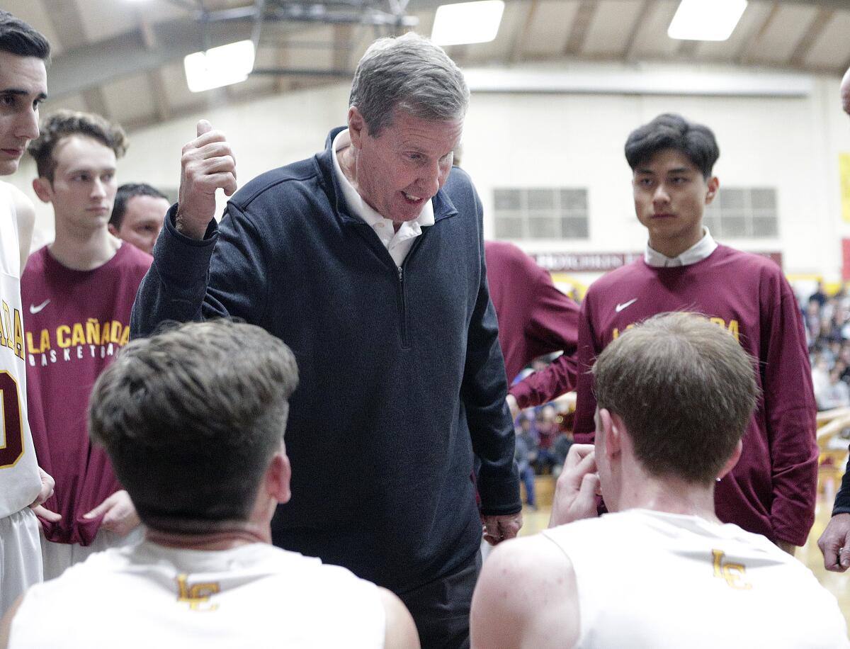 La Canada's head coach Tom Hofman talks with his team between quarters in the game against St. Francis in CIF Southern Section Division II-A first-round boys' basketball playoff at La Canada High School on Wednesday, February 12, 2020.