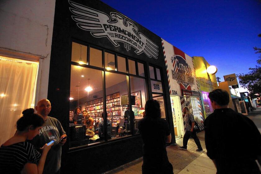 People wait for an in-store performance by the Southern California band Dabble at Permanent Records on York Avenue in Highland Park, which has become a hub for musicians, record stores and music labels but lacks a great performance venue.