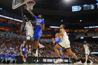 Louisville, KY - March 26: San Diego State's Aguek Arop scores against Creighton's in an Elite 8 game in the NCAA Tournament on Sunday, March 26, 2023 in Louisville, KY. (K.C. Alfred / The San Diego Union-Tribune)