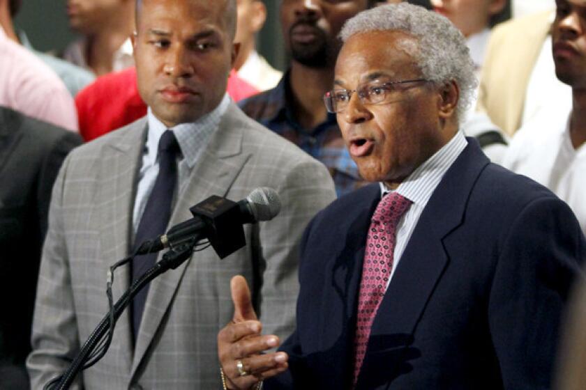 Billy Hunter, right, shown with Derek Fisher, addresses the media during NBA labor negotiations in 2011.