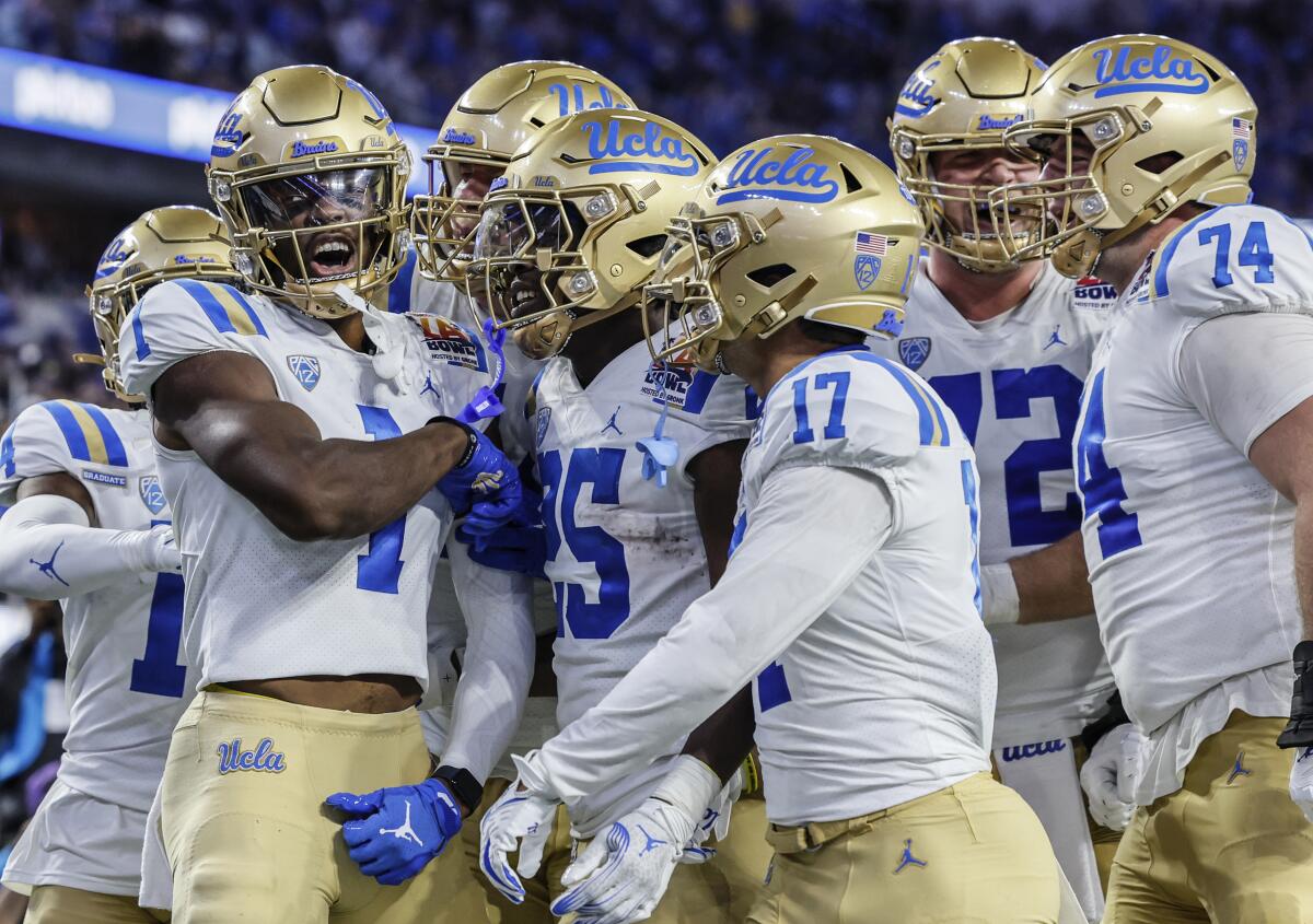UCLA wide receiver J.Michael Sturdivant (1) celebrates with teammates after scoring a touchdown against Boise State.