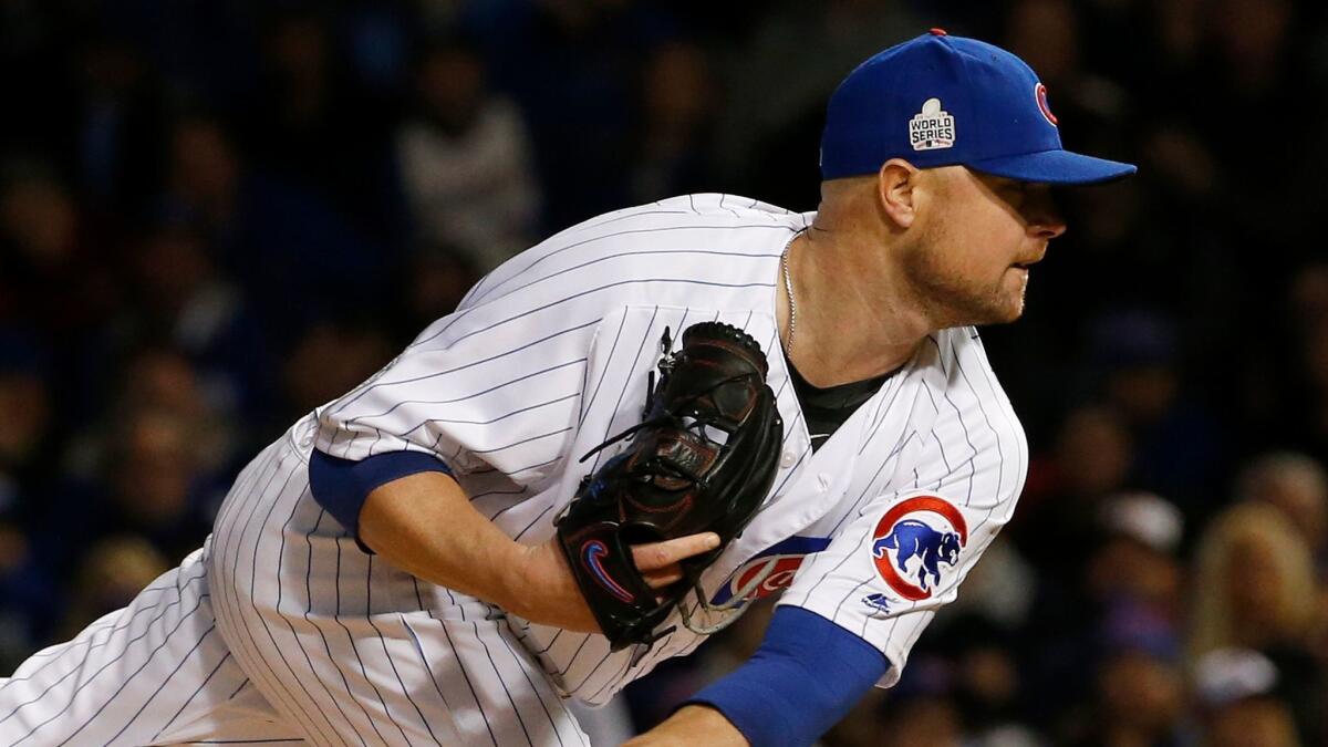 Chicago Cubs starting pitcher Jon Lester throws during the first inning of Game 5 of the Major League Baseball World Series against the Cleveland Indians.