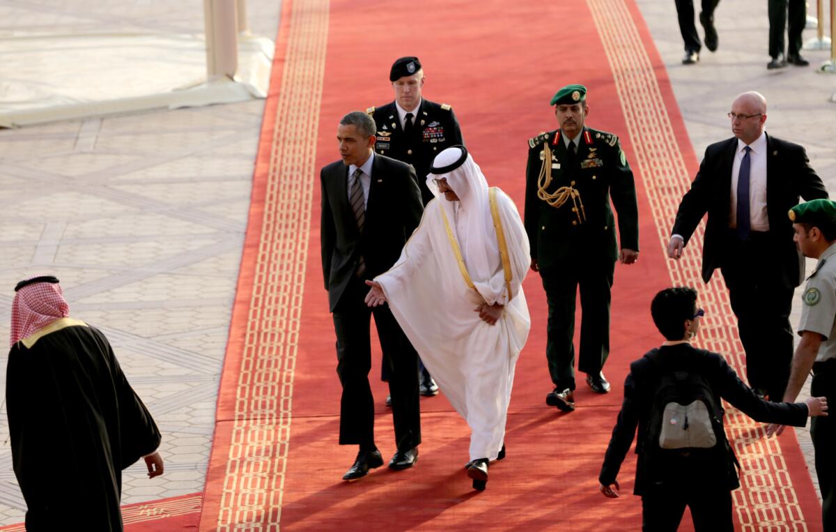 President Obama is welcomed by Prince Khalid Bandar bin Abdulaziz al Saud in Riyadh, Saudi Arabia.