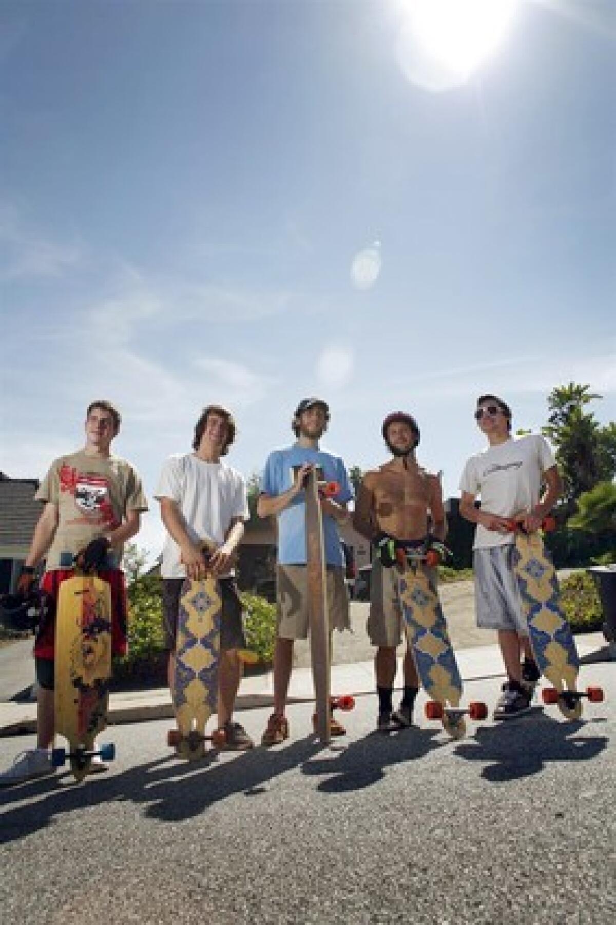 Longboarders are shown at the popular Franklin Street hill in Santa Monica. From left, Kevin Reimer, 19, of Vancouver, Canada; James Kelly, 18, of Petaluma, Calif.; Adam Stokowski, 23, of Springfield, Va.; Adam Colton, 25, of Santa Monica; and Louis Pilloni, 22, of Thousand Oaks.
