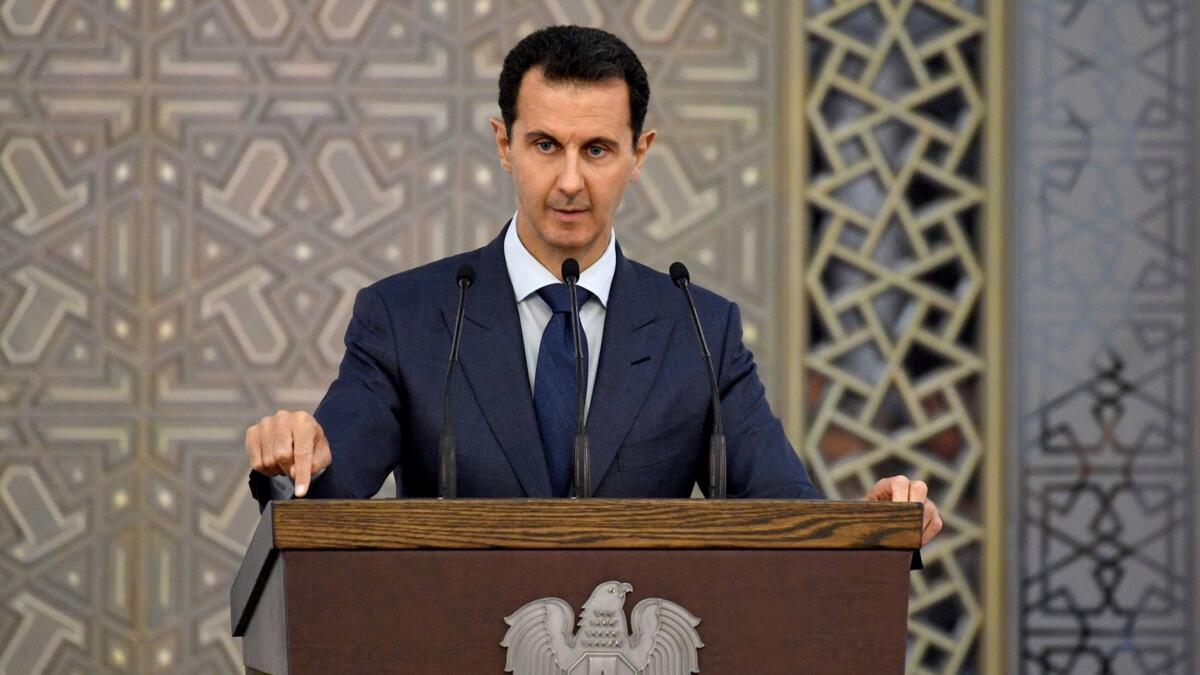 Syrian President Bashar Assad speaks to Syrian diplomats in Damascus on Aug. 20.