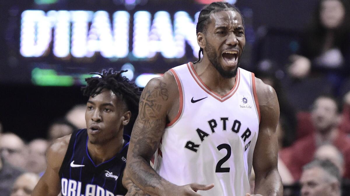 Toronto Raptors forward Kawhi Leonard heads up court during the first half in Game 5 of a first-round NBA playoff series against the Orlando Magic on Tuesday, April 23 in Toronto.