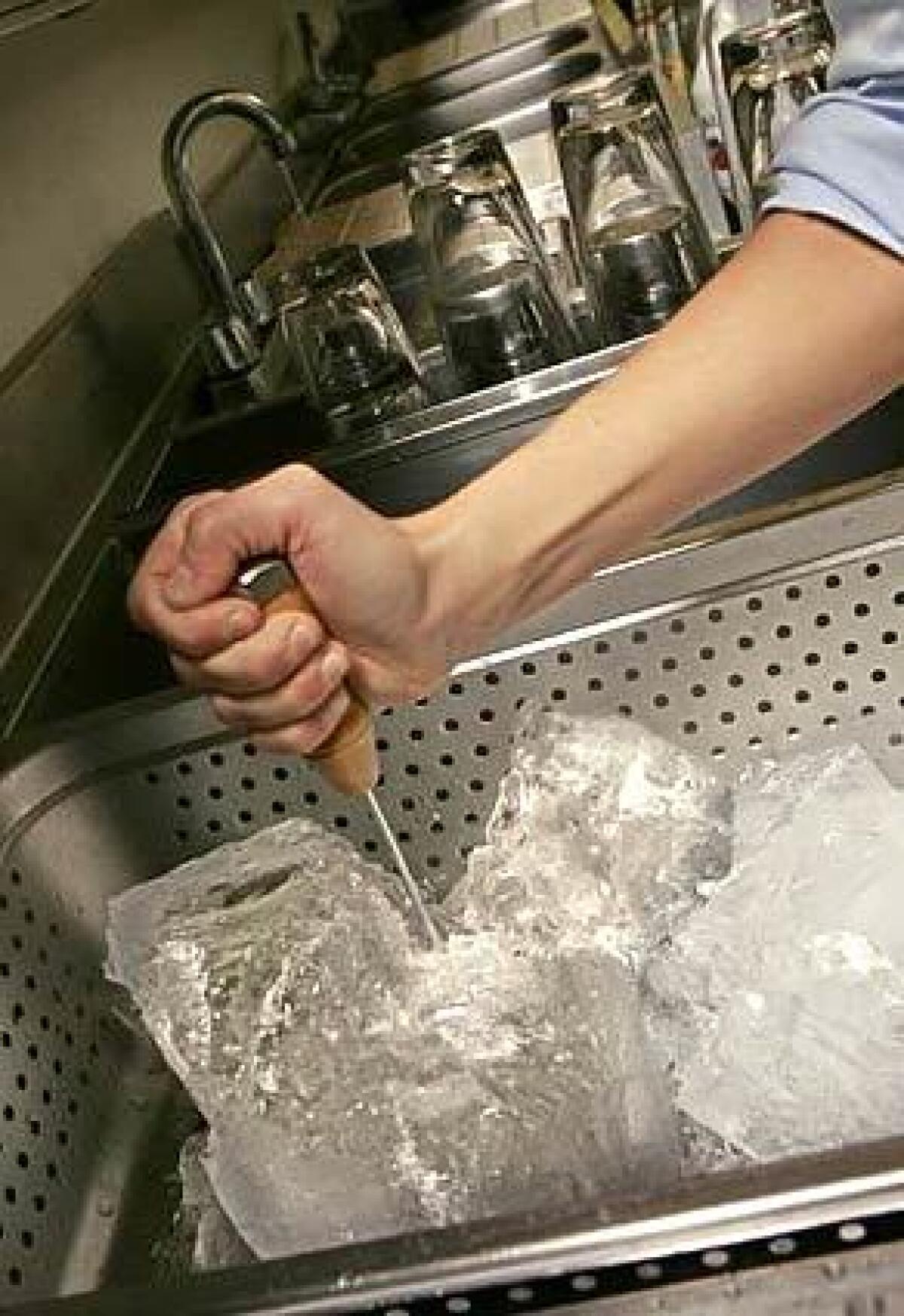 At Sona in L.A., a block of ice is on hand so the bartender can pick off the desired chip or chunk.