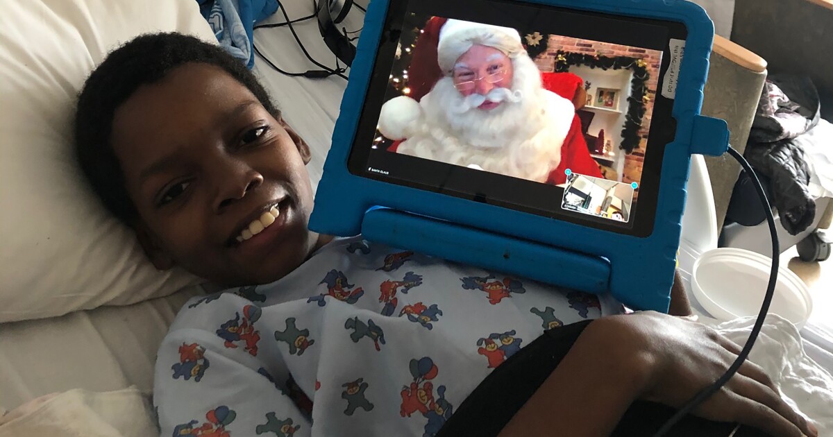 L.A.’s children’s hospitals welcome Santa, with a Zoom link to the North Pole and a mask under his beard