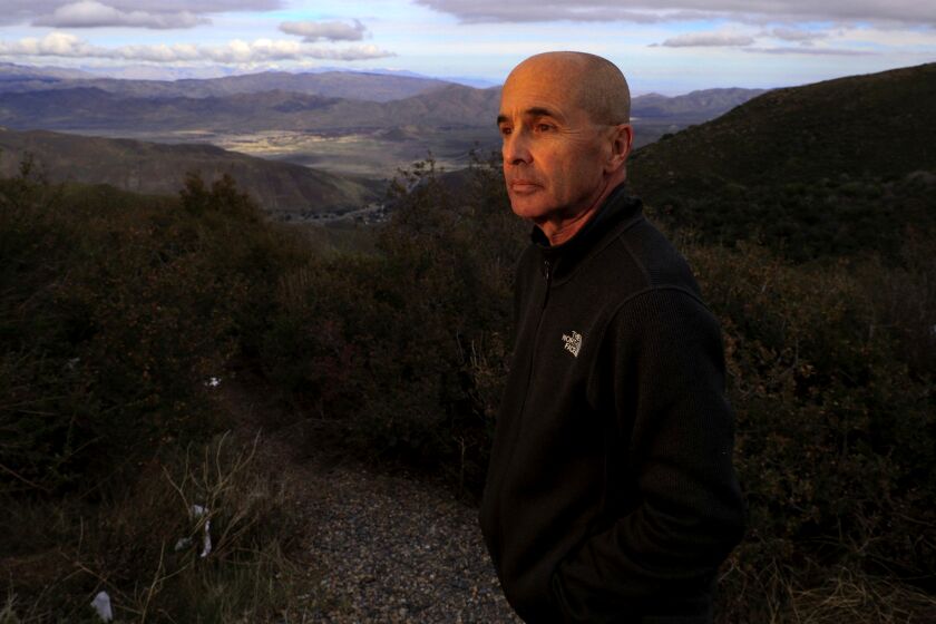 JULIAN,CA., FEB 1, 2019: Thriller/crime novelist Don Winslow stands on a hilltop in San Diego County overlooking a portion of the Borrego Valley where people and drugs coming from Mexico intersect on the desert floor below him February 1, 2019. Winslow's new book, "The Border" comes out in February. The novel is the third in a sweeping trilogy of America's drug wars (Mark Boster / For The Times).