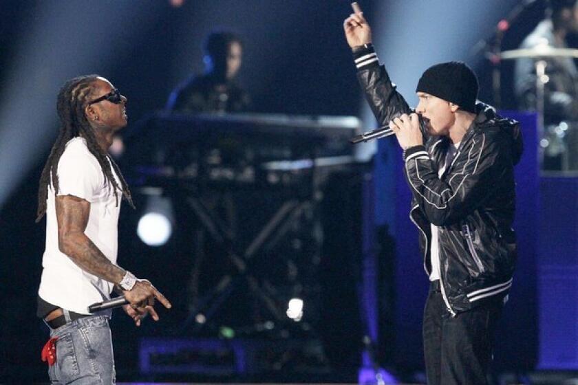 Eminem and Lil Wayne perform together during the Grammy show.