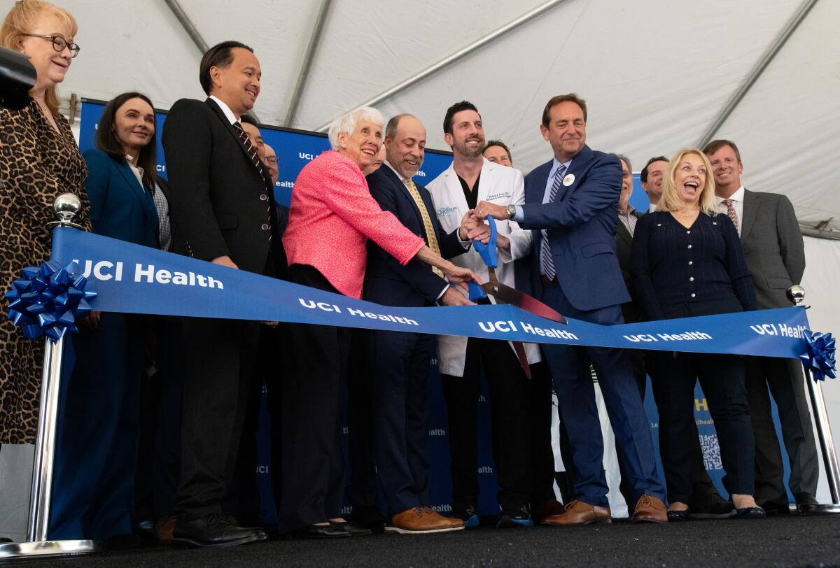 Shirley Dettloff, Chad Lefteris, Dr. Michael Russo and Randy Rogers, at center cut a ribbon on Wednesday.