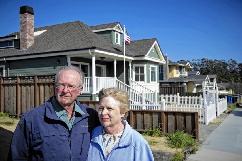 The 2010 natural gas explosion in San Bruno, Calif., caused the floor in the home of John McGlothlin and wife Joanne to tremble like an “earthquake,” he says. Above, the couple visit an empty lot last week where a house was destroyed by the blast.