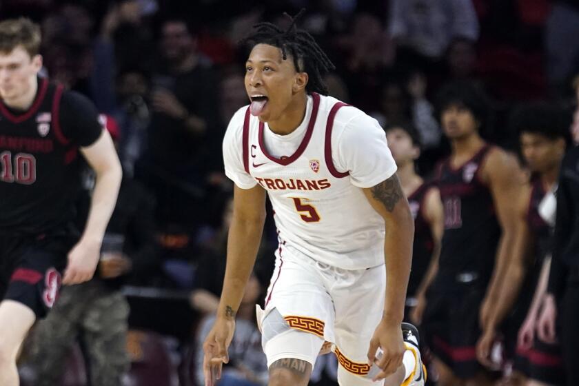 Southern California guard Boogie Ellis reacts after making a 3-point basket against Stanford.