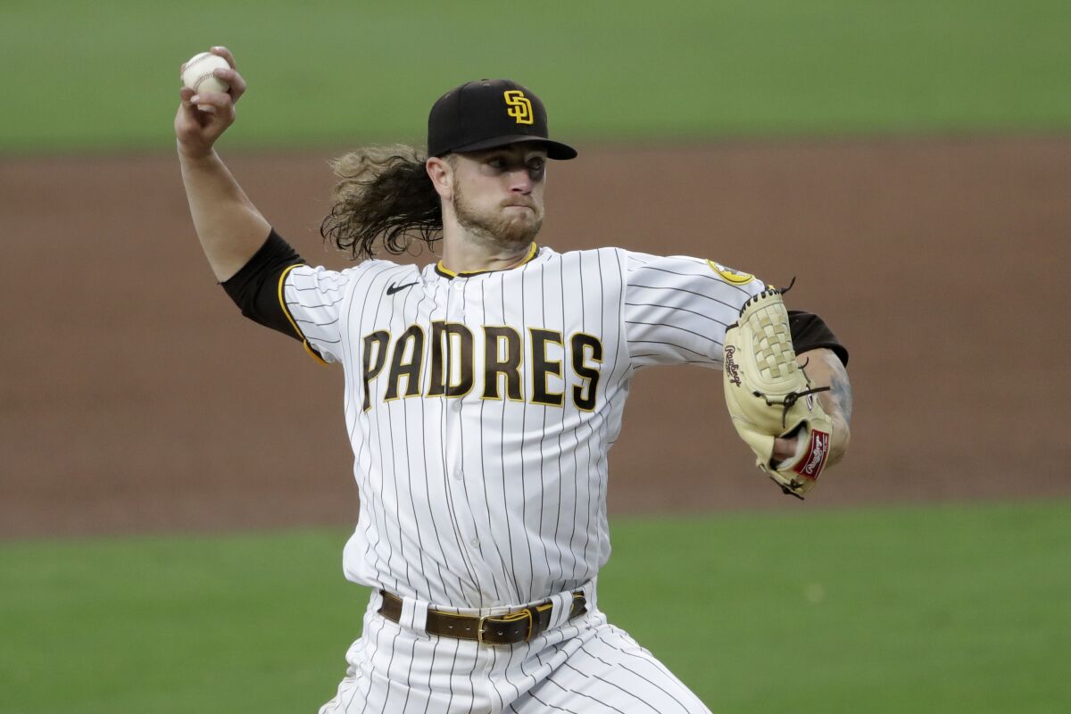 San Diego Padres starting pitcher Chris Paddack works against a Los Angeles Dodgers batter during the fourth inning of a baseball game Monday, Aug. 3, 2020, in San Diego. (AP Photo/Gregory Bull)