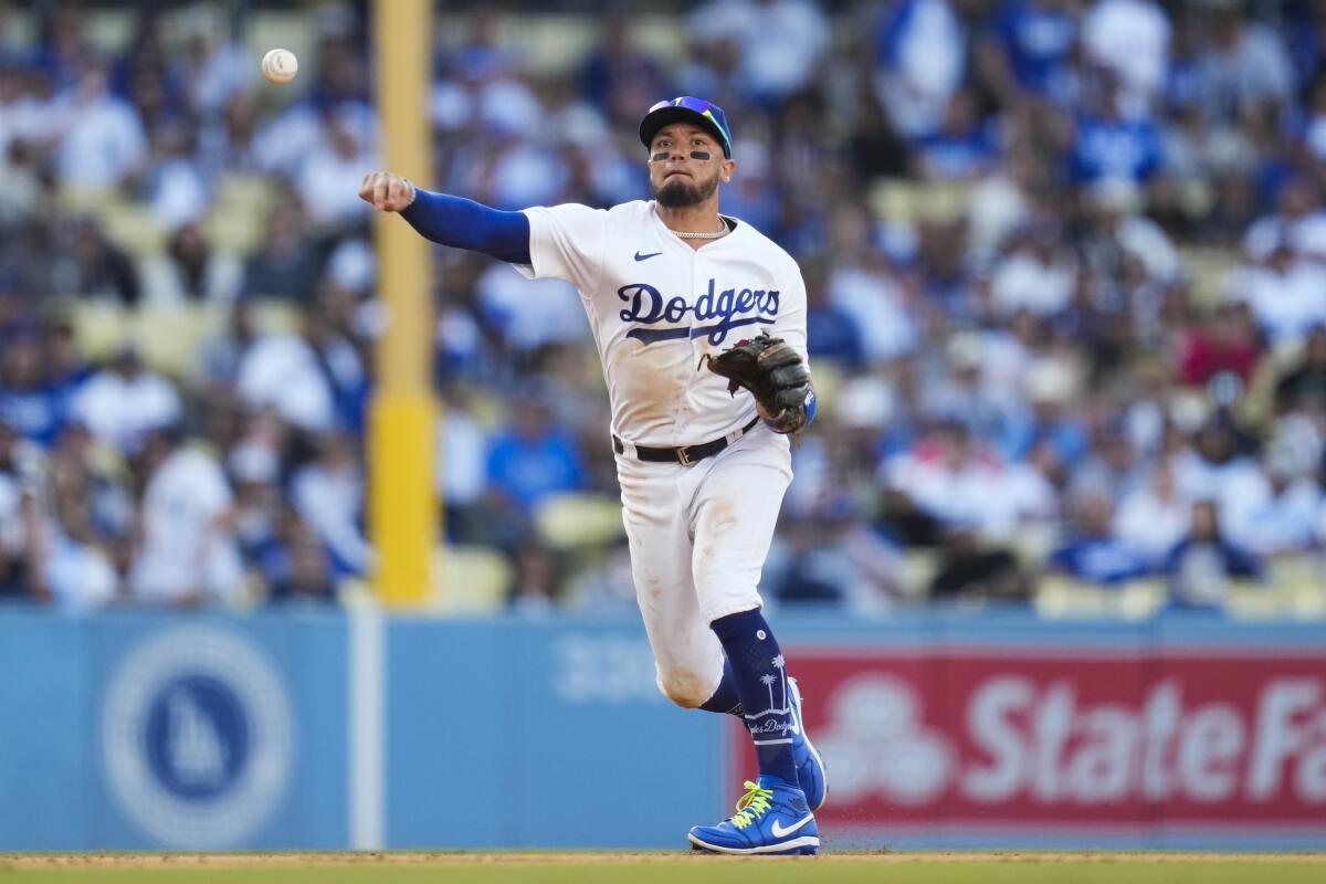 Dodgers shortstop Miguel Rojas throws to first against the New York Yankees on  June 3, 2023, at Dodger Stadium.