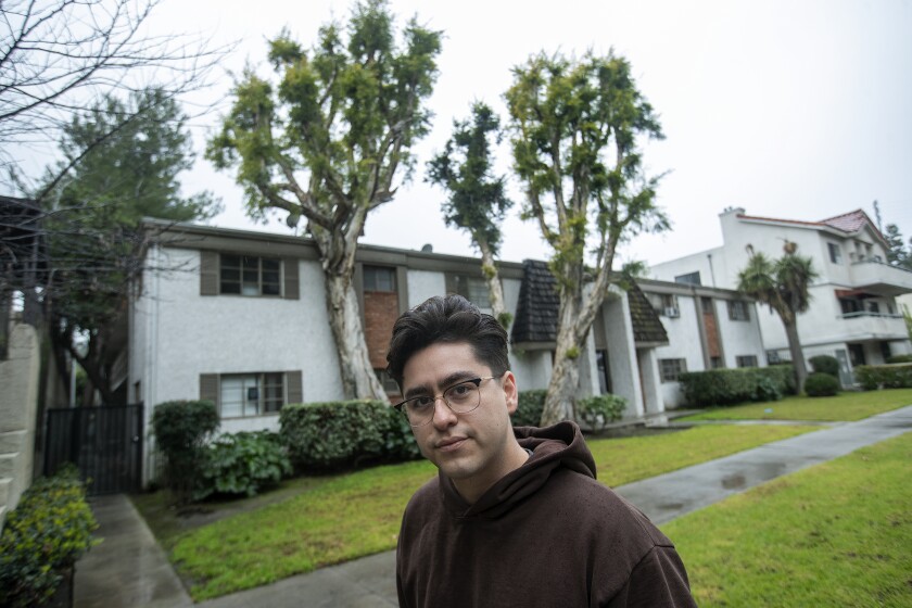 Jacob Guardado outside his two-bedroom apartment in Studio City.