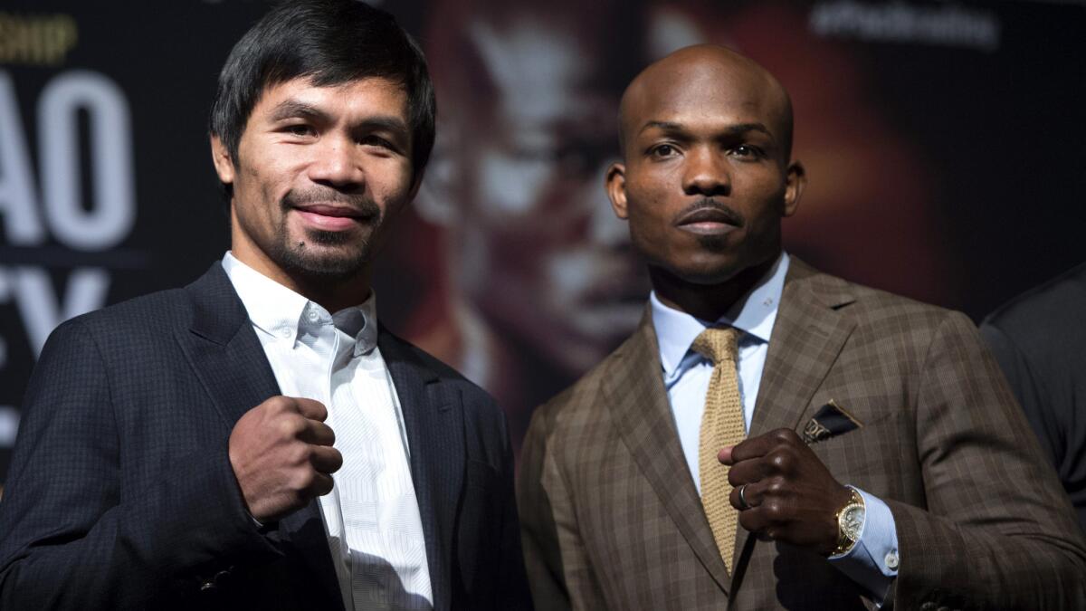 Manny Pacquiao and Timothy Bradley pose during their news conference on Wednesday in Las Vegas.