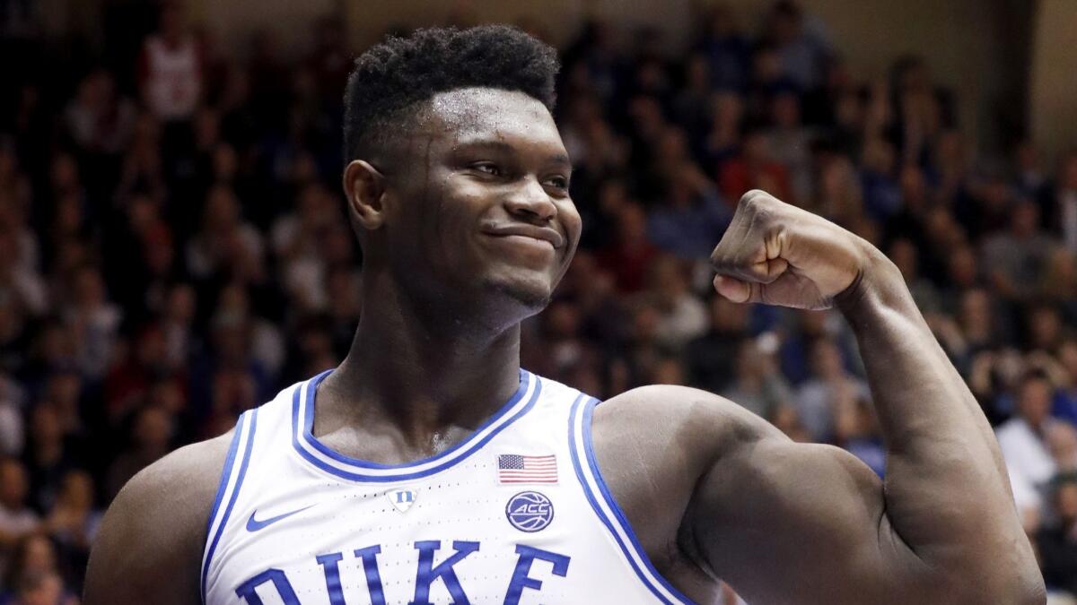 Duke's Zion Williamson (1) celebrates, which he'll likely also do after being the No. 1 pick in the draft.