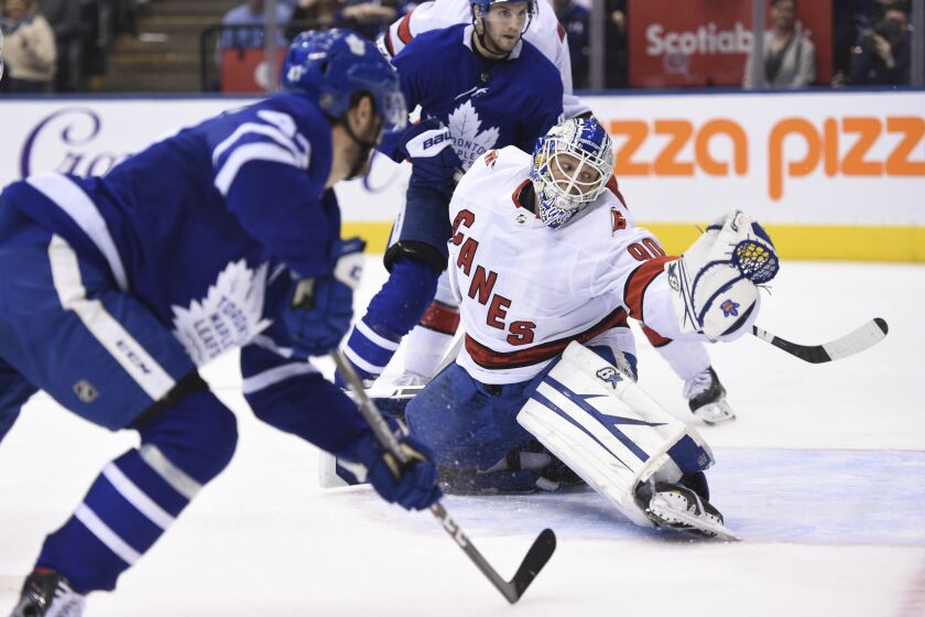 Toronto Maple Leafs left wing Pierre Engvall (47) scores his team's third goal of the game against Carolina Hurricanes emergency goalie David Ayres (90) during second-period NHL hockey game action in Toronto, Saturday, Feb. 22, 2020. (Frank Gunn/The Canadian Press via AP)