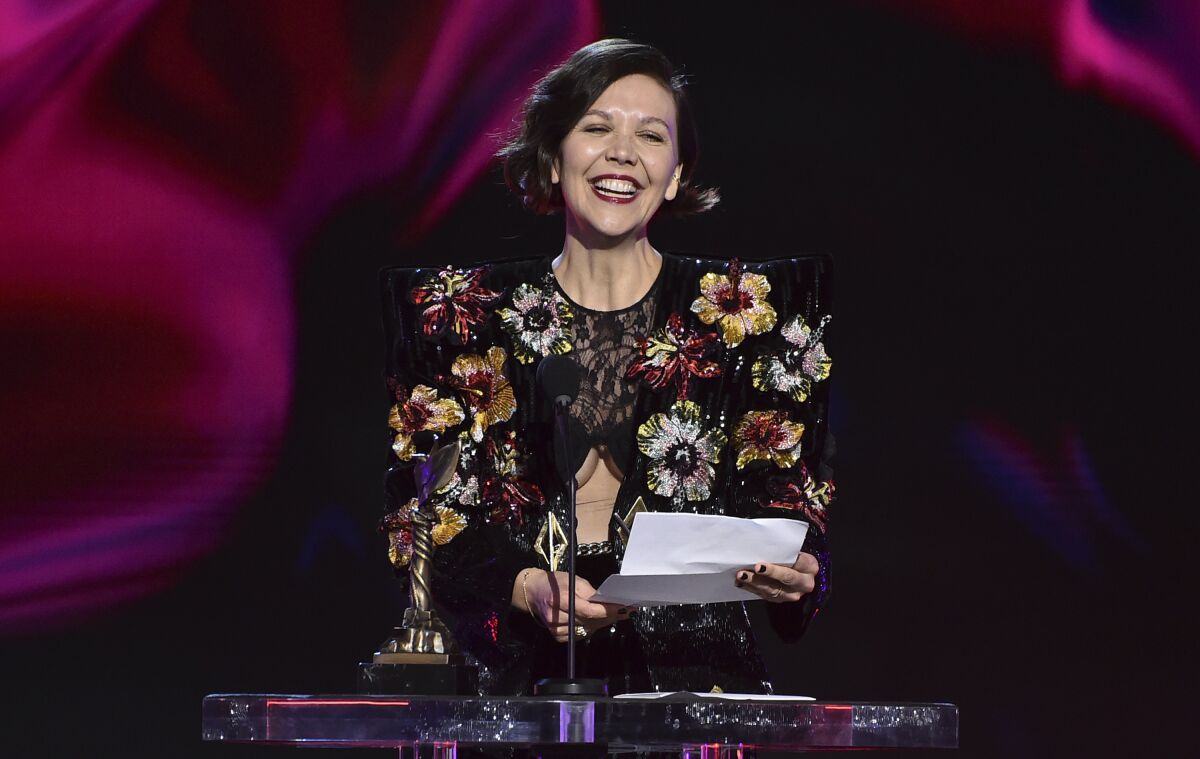 Maggie Gyllenhaal accepts the award for best director for "The Lost Daughter" at the 37th Film Independent Spirit Awards on Sunday, March 6, 2022, in Santa Monica, Calif. (Photo by Jordan Strauss/Invision/AP)