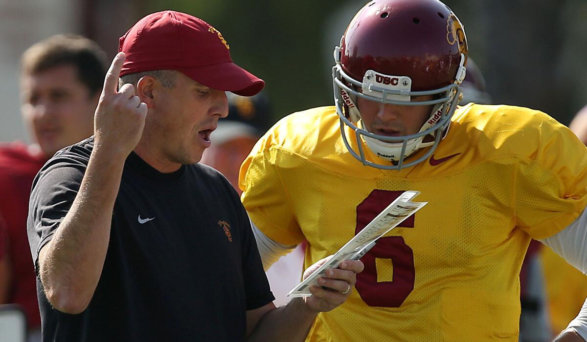 USC offensive coordinator Clay Helton led quarterback Cody Kessler and the Trojans to a victory in the Las Vegas Bowl during his first stint as interim coach.