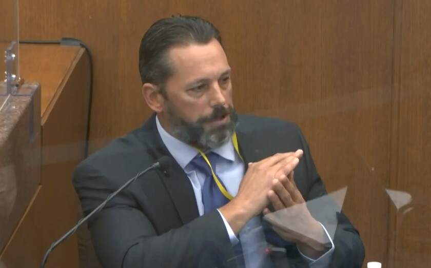In this image from video, Minneapolis Police Lt. Johnny Mercil, a use of force trainer, testifies as Hennepin County Judge Peter Cahill presides Tuesday, April 6, 2021, in the trial of former Minneapolis police Officer Derek Chauvin at the Hennepin County Courthouse in Minneapolis. Chauvin is charged in the May 25, 2020 death of George Floyd. (Court TV via AP, Pool)