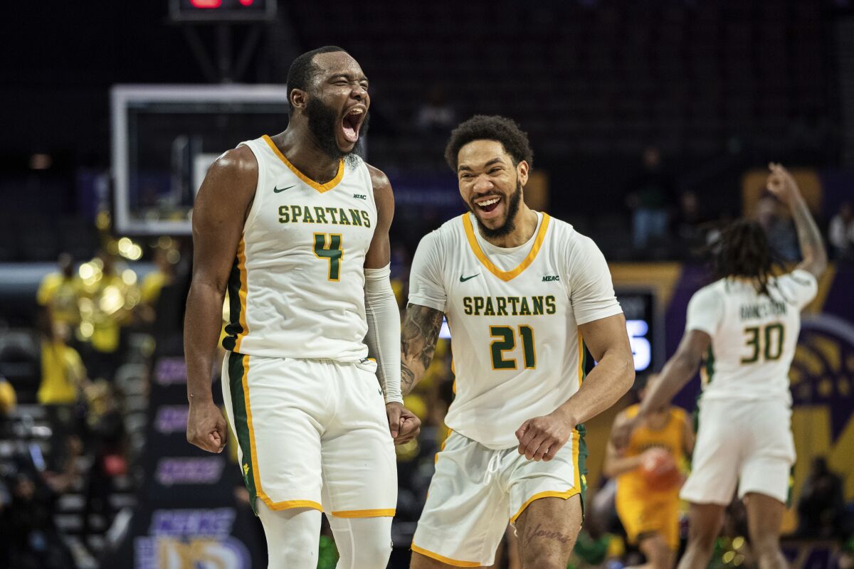 Norfolk State guard Joe Bryant Jr. (4) and forward Dana Tate (21) celebrate after Bryant.
