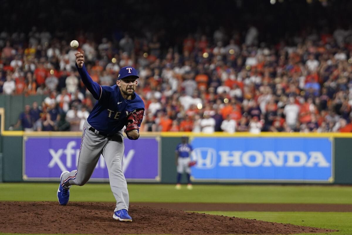 Texas Rangers starting pitcher Nathan Eovaldi delivers during the seventh inning in Game 6 of the ALCS on Sunday night.